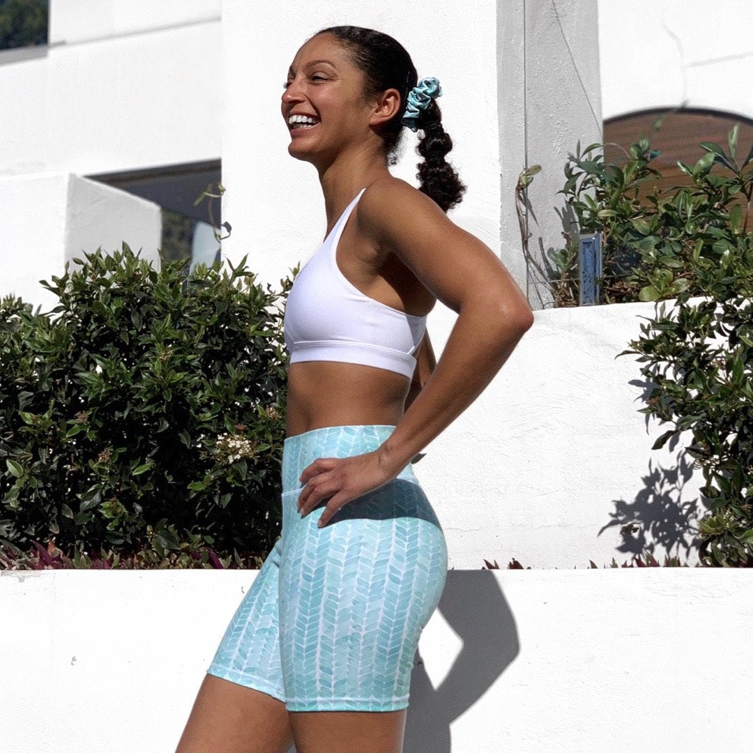 Australian ethical and sustainable activewear matching set made from recycled plastic materials. Aqua mint patterned bike shorts.