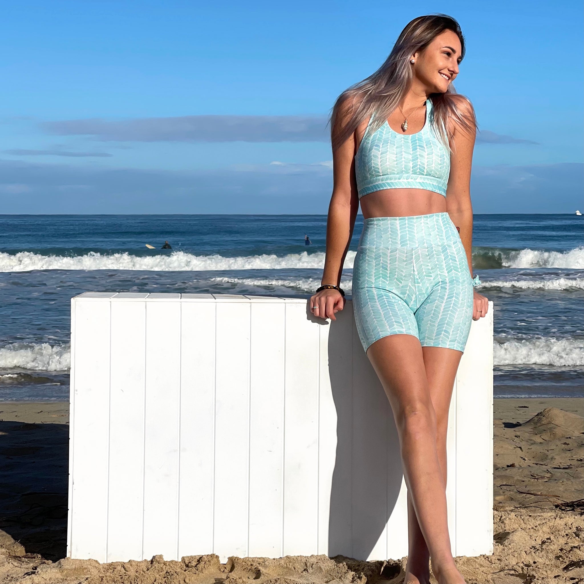 Australian ethical and sustainable activewear matching set made from recycled plastic materials. Aqua mint patterned sports bra.