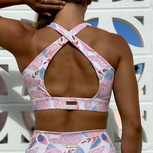 Australian ethical and sustainable activewear matching set made from recycled plastic materials. Pink floral print lycra sports bra.